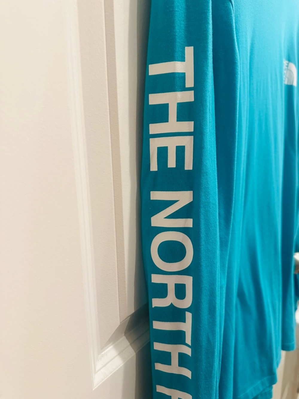 The North Face Teal Long Sleeve Tee with White Sleeve Text